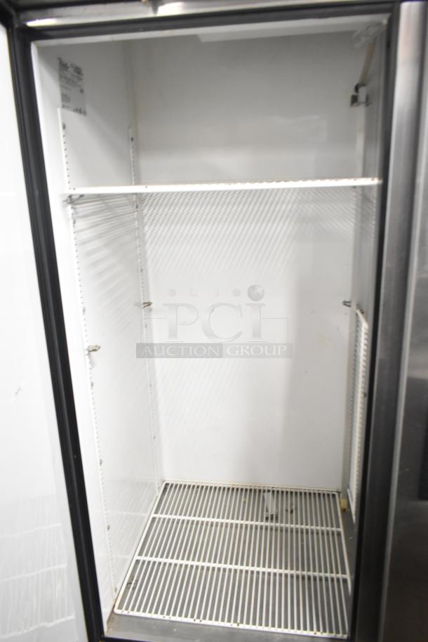 True T-49 Commercial 2 Door Reach-In Cooler, 115 Volts, 1 Phase. Clean interior, adjustable shelves, model label visible.