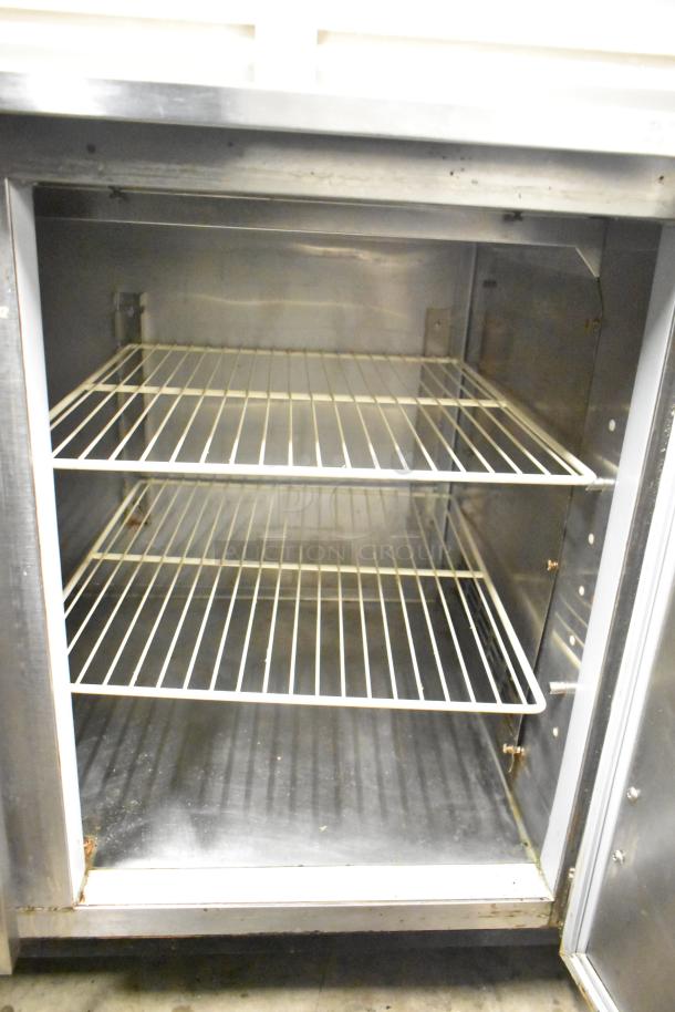 Duke RBC-60 M 2 Door Work Top Cooler, 120 Volts, 1 Phase. Interior view with two wire shelves, stainless steel finish.