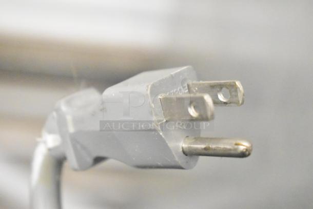 Close-up of a power plug for the Duke RBC-60 M Commercial 2 Door Work Top Cooler, 120 Volts, 1 Phase.