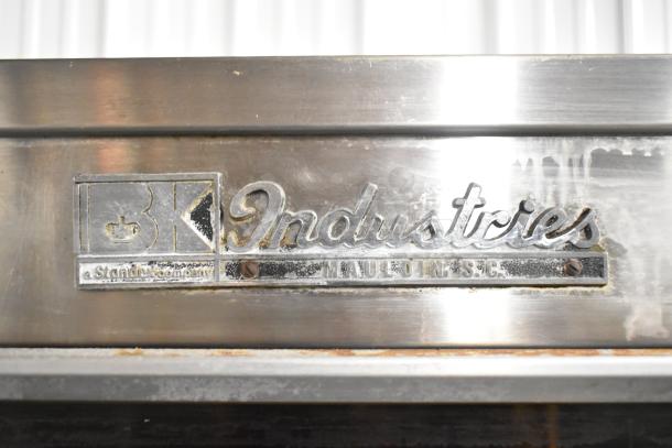 BK Industries SR rotisserie oven with heated holding cabinet, commercial casters; stainless finish with brand label.