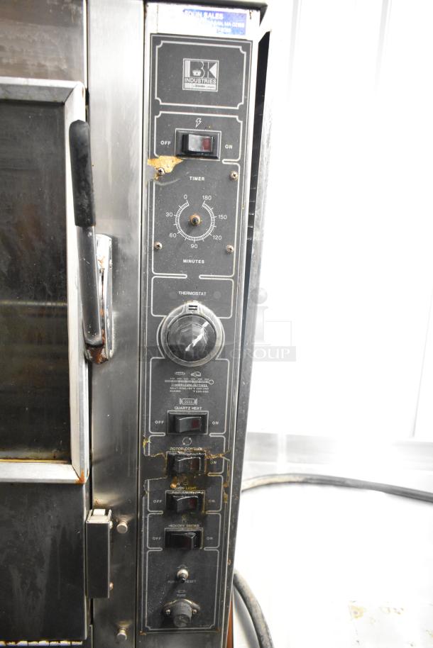 BK Industries SR rotisserie oven with lower heated cabinet, commercial casters, 120/208V, 3 phase, visible controls and labels.