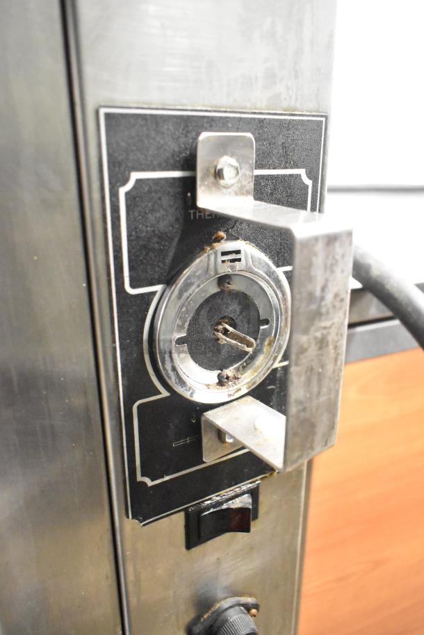 BK Industries SR Commercial Rotisserie Oven with lower heated cabinet, visible thermostat control, on commercial casters.