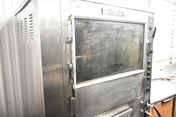 BK Industries SR Rotisserie Oven with heated holding cabinet and casters. Visible "Caution Hot" label. 120/208V, 3 Phase.