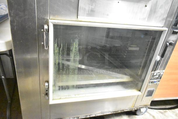 BK Industries SR Commercial Rotisserie Oven with lower heated cabinet, stainless steel, on casters, 120/208V, 3-phase.