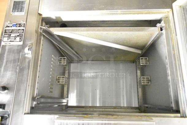 BK Industries SR commercial rotisserie oven with lower heated holding cabinet, visible interior details, and metal finish.