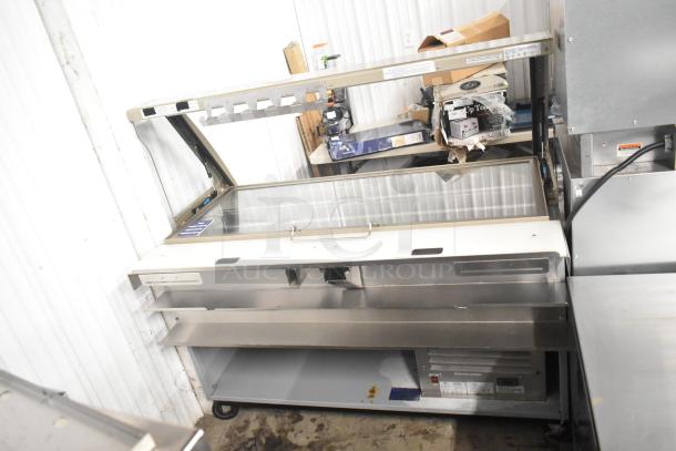 Duke SWD700-60LED M sandwich prep line with a lowering sneeze guard and commercial casters. 120V, 1 phase, clean condition.