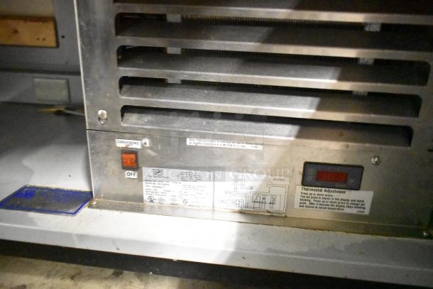 Duke SWD700-60LED M sandwich prep line with lowering sneeze guard, control panel view, commercial casters, 120V, 1 phase.