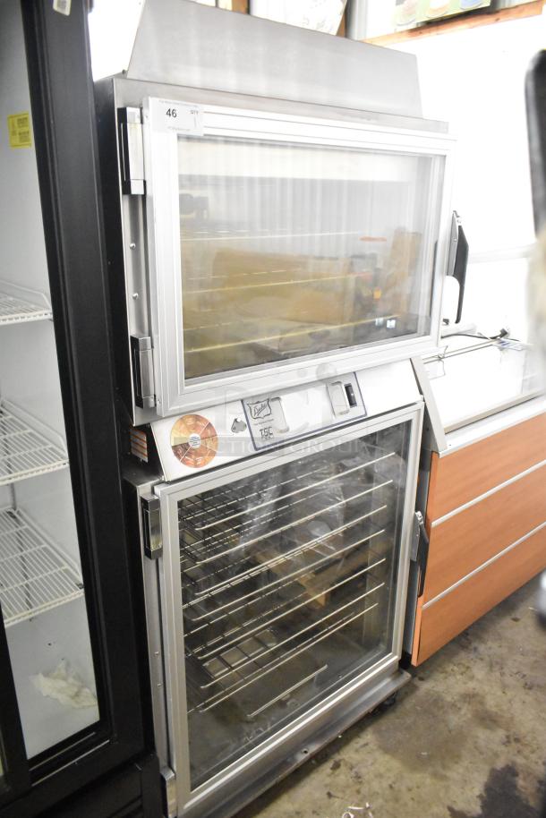 Duke TSC3-6/18 commercial oven proofer on casters, 208V, 3 phase, stainless steel, clear doors, model label visible.