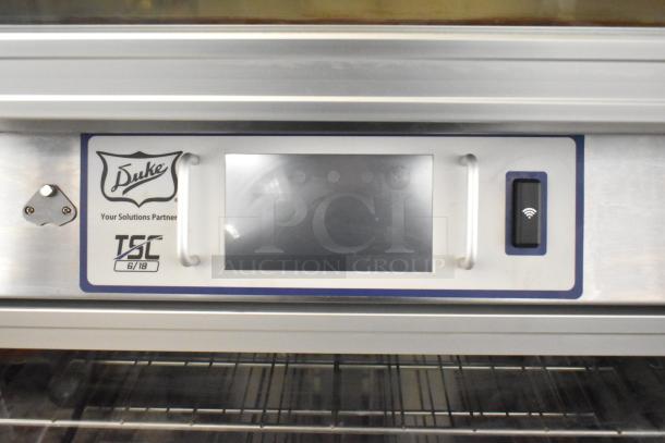 Duke TSC3-6/18 commercial oven proofer on casters, 208 volts, 3 phase, with control panel and Duke logo.