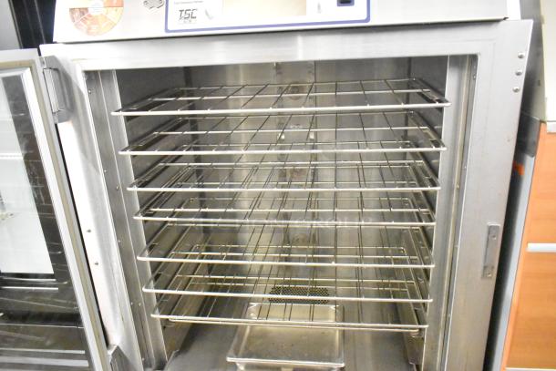 Duke TSC3-6/18 commercial oven proofer with multiple wire racks, stainless steel, 208V, 3 phase, on commercial casters.