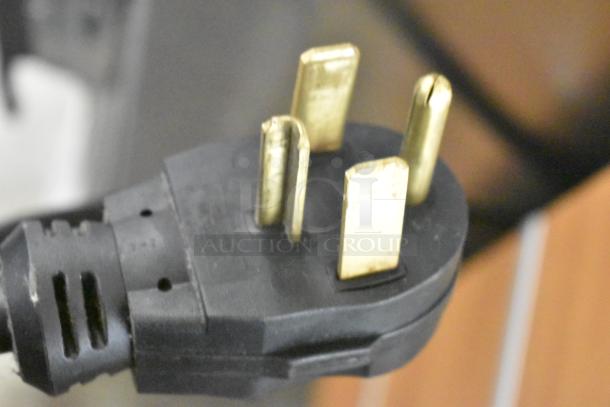 Close-up of a four-prong plug for Duke TSC3-6/18 Commercial Oven Proofer, showing gold electrical contacts.