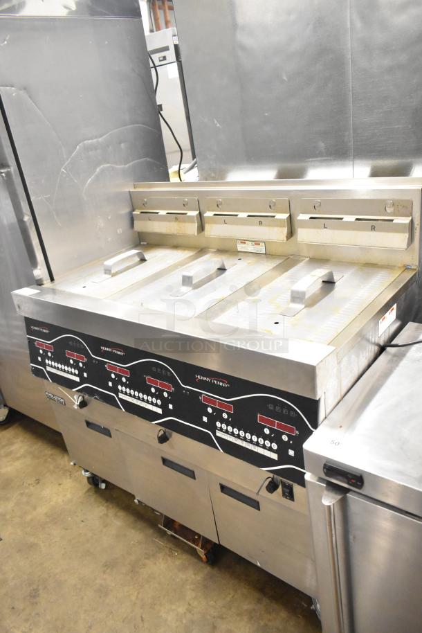 Henny Penny EEG-253 3 bay propane fryer, commercial casters, 225,000 BTU, stainless steel, control panel visible.