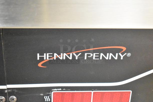 Henny Penny EEG-253 commercial propane gas fryer, 3 bay, 225,000 BTU. Features logo and control panel. On commercial casters.