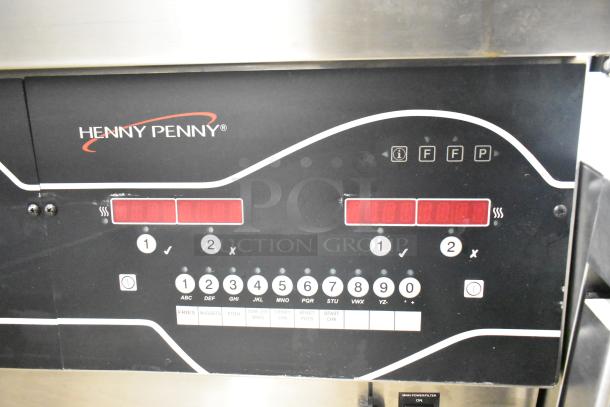 Henny Penny EEG-253 commercial fryer control panel with buttons for settings, displaying model branding and function labels.