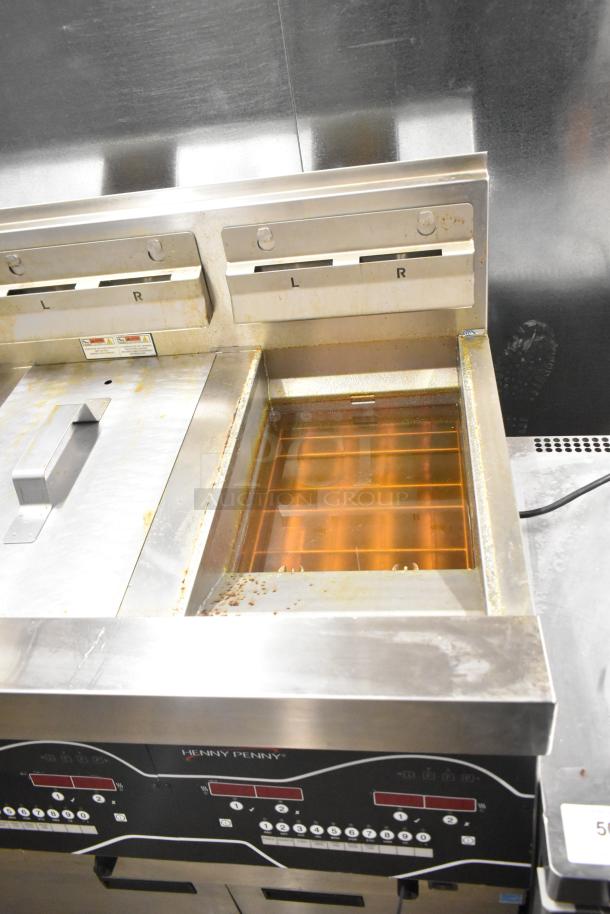 Henny Penny EEG-253 commercial gas fryer, 3 bay, 225,000 BTU, on casters. Stainless steel, visible controls, good condition.