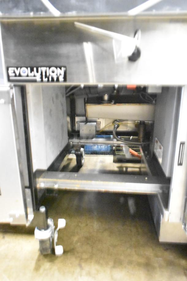 Henny Penny EEG-253 3-bay propane gas fryer, 225,000 BTU, on commercial casters, features "Evolution Elite" label.