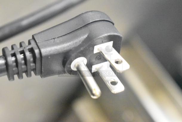 Close-up of a three-prong plug for Turbo Air M3F24-1-N commercial freezer, 115 volts, 1 phase.