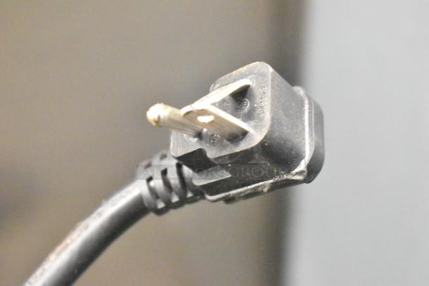 Close-up of a power plug for a 2021 Migali C-2RB-35-HC Commercial 2 Door Reach In Cooler, 115 Volts, 1 Phase.