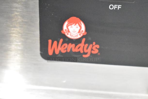 Henny Penny BW-100 countertop heated holding cabinet. Features include 120 volts, 1 phase, brand logo. Suitable for commercial use.