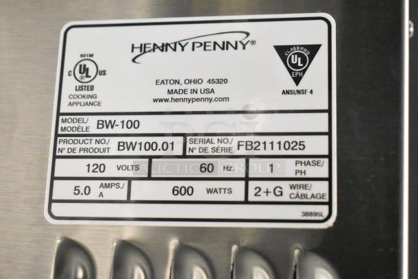 Henny Penny BW-100 Heated Holding Cabinet label showing model, voltage, and serial numbers; 120 volts, 1 phase.