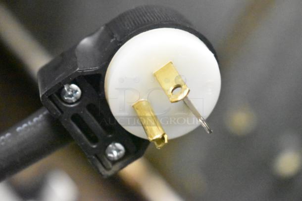 Close-up of a power plug for a Henny Penny BW-100 Commercial Countertop Heated Holding Cabinet, 120V, 1 Phase.