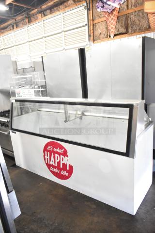 Master-Bilt commercial ice cream dipping cabinet, 115 volts, 1 phase, with glass display, brand logo visible, good condition.