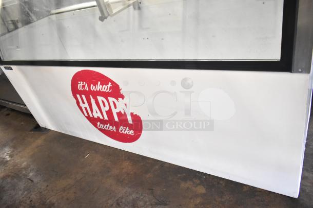 Master-Bilt commercial ice cream dipping cabinet, 115 volts, 1 phase, featuring logo "it's what happy tastes like," used condition.