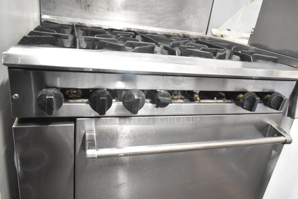 CRC Commercial Gas 6-Burner Range with oven, over shelf, and backsplash. Durable stainless steel, used condition.