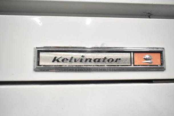 Kelvinator T5CHSGHP-4 commercial reach-in fridge, 4 half-size doors, visible Kelvinator logo. 115/208-230V, 1 phase.
