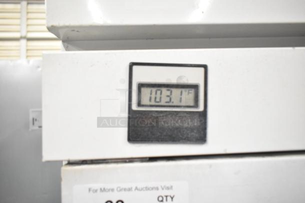 Kelvinator T5CHSGHP-4 commercial fridge, 4 half doors, digital display shows 103.1°F, 115/208-230V, 1 phase.