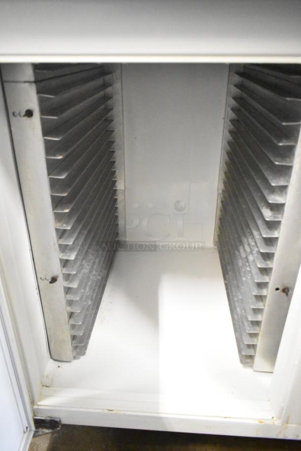 Kelvinator T5CHSGHP-4 commercial fridge interior showing shelving. Suitable for 115/208-230V, 1 phase. Clean condition.