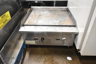 Qualite Commercial Countertop Gas Griddle, stainless steel, dual knob controls, visible wear, Qualite logo plate.