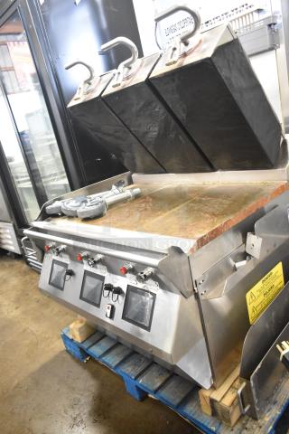 Commercial electric flat top griddle with 3-section panini clam shell. Stainless steel. Used condition. Safety warning labels visible.