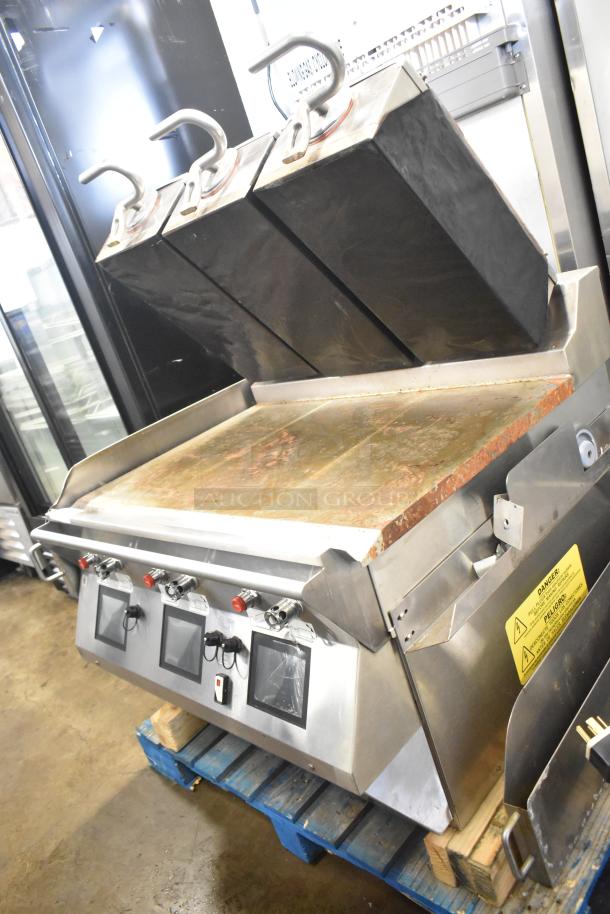 Commercial electric flat top griddle with 3-section panini style clam shell, stainless steel, used condition, visible control knobs.