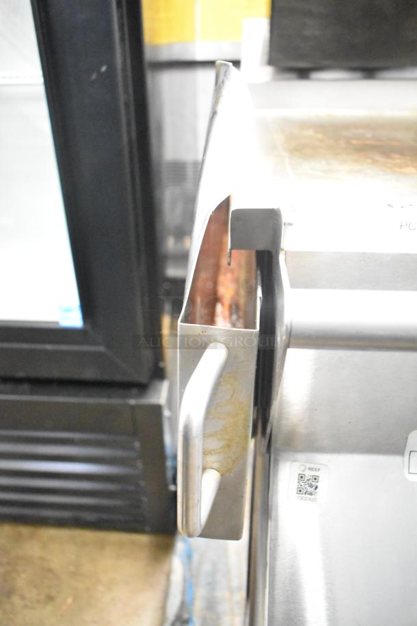 Commercial electric flat top griddle, with 3-section panini-style clam shell. Stainless steel, sturdy handle, used condition.