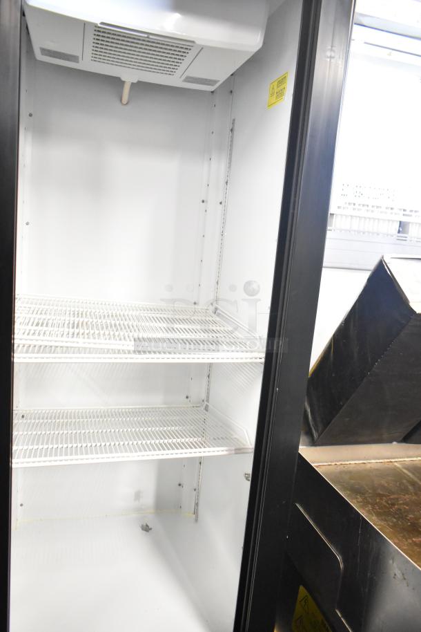 Beverage Air MT53-1-SD commercial cooler, 2-door, shelves visible, well-maintained interior, 115 volts, 1 phase.