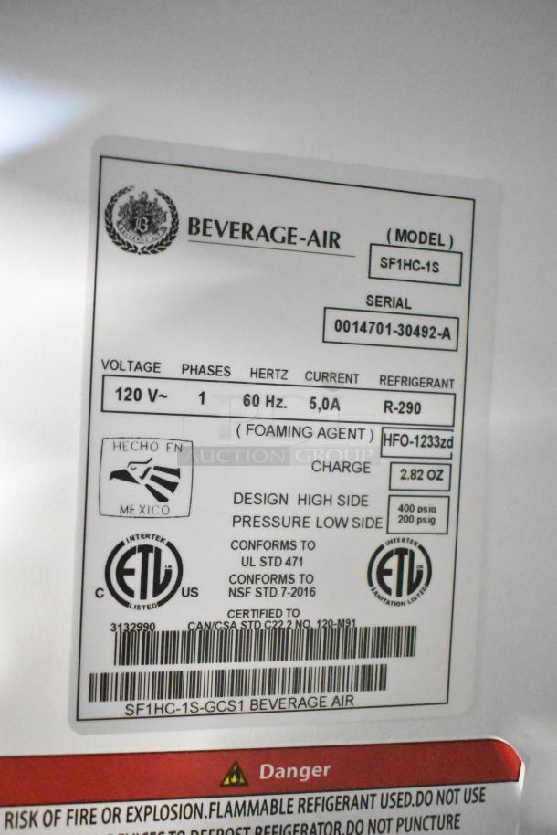 Beverage Air SF1HC-1S single door commercial freezer label detailing model, serial number, voltage, and certifications.