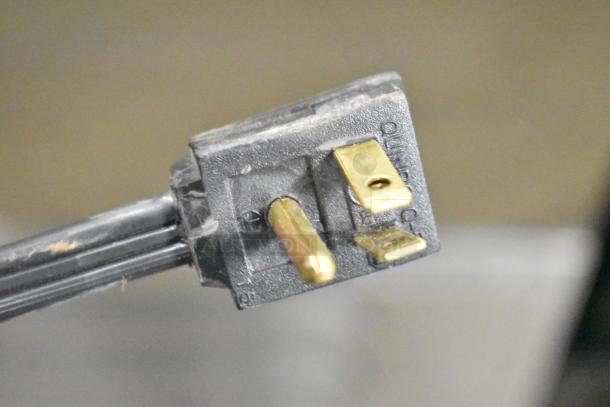 Close-up of a power plug for a Beverage Air SF1HC-1S commercial freezer, indicating 115 volts, 1 phase.