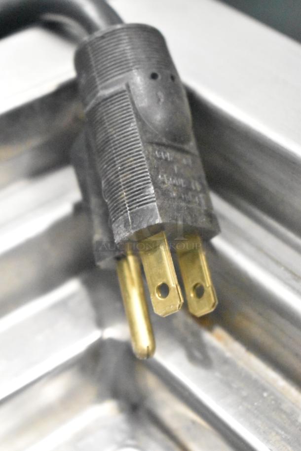 2021 H&K Commercial French Fry Freezer plug. 120 volts, 1 phase; black plastic with brass prongs in good condition.