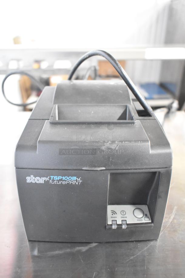 Star TSP100II receipt printer, black, countertop model, features ready, error, feed buttons, in good condition.