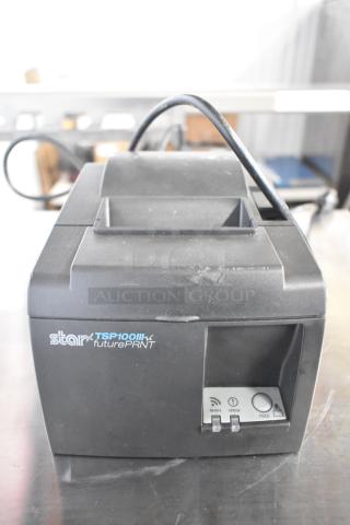 Star TSP100II receipt printer, black, countertop model, features ready, error, feed buttons, in good condition.