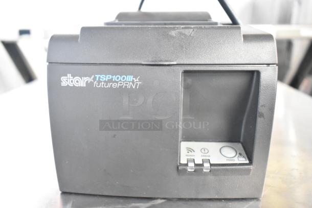 Star TSP100II countertop receipt printer, black, features status indicators and feed button, model number visible, good condition.