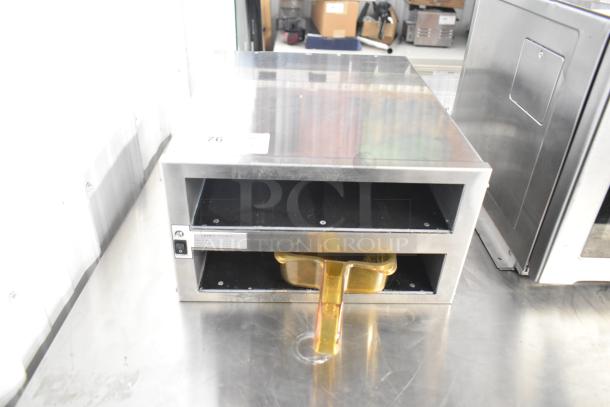 Henny Penny MPC-22 countertop holding bin, 2 shelves, 4 pan capacity, stainless steel, 120V, used condition, visible power switch.