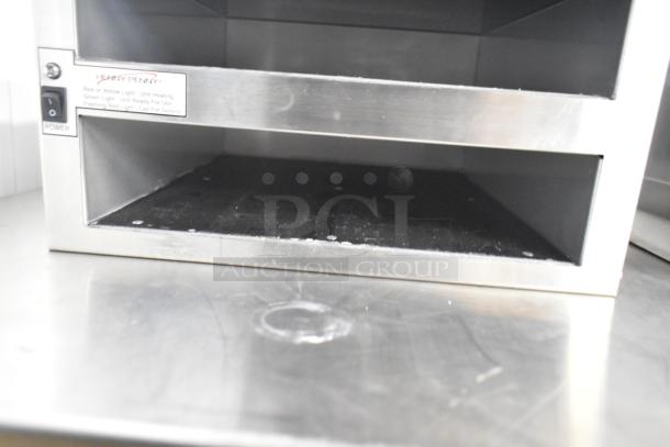 Henny Penny MPC-22 countertop holding bin, 2 shelves, 4 pan capacity, 120 volts, 1 phase, stainless steel, with visible power switch.