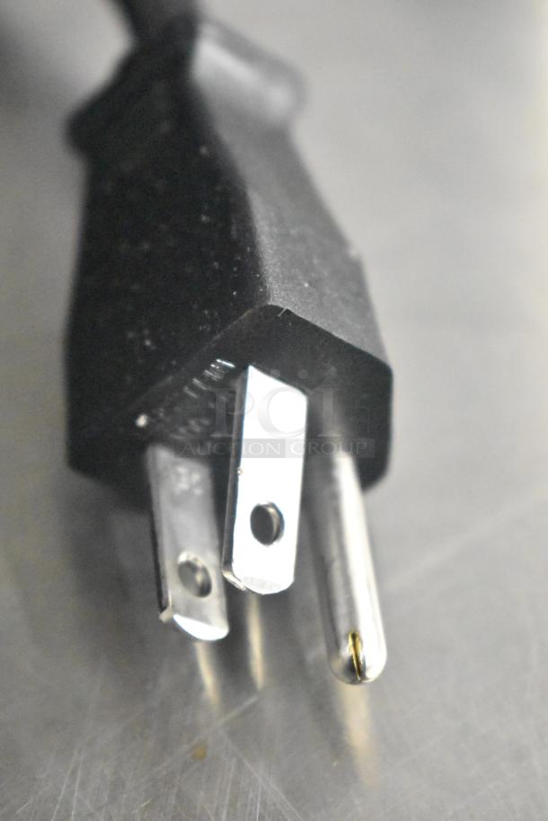 Close-up of a three-prong plug for Henny Penny MPC-22 countertop holding bin. 120 volts, 1 phase compatible.