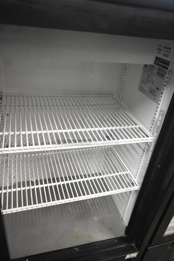 2018 True GDM-41SL-48-HC-LD commercial 2-door reach-in cooler, 115V, 1 phase, with shelving. Clean interior, visible tags.