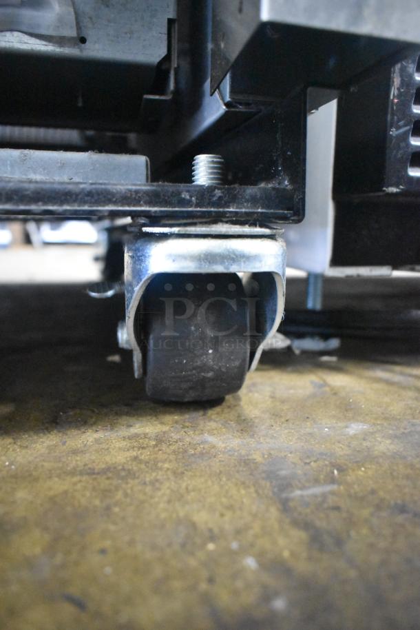 2022 True T-19F-HC freezer caster detail, sturdy swivel caster, supports commercial use, photo of base wheel.