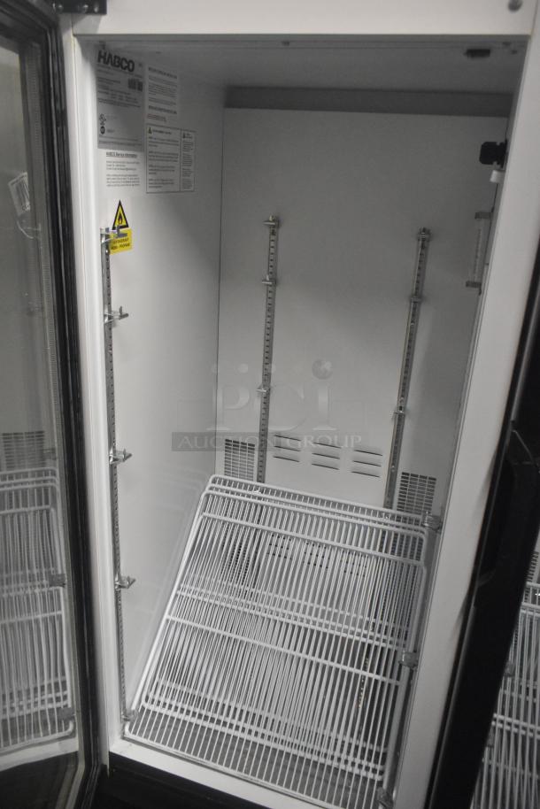 Habco SE12HC Commercial Single Door Cooler, 115V, 1 Phase. Interior view with shelving and labels visible.