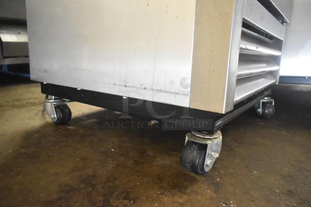 2022 True T-19F commercial freezer on casters, single door, stainless steel, 115V, 1 phase, shows some surface wear.