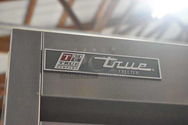 2022 True T-19F Commercial Single Door Reach-In Freezer, stainless steel with logo, on casters, 115 volts, 1 phase.